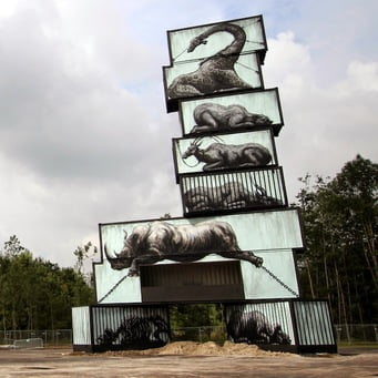 Poignant and Beautiful Mural of Caged Animals Painted Onto Shipping Containers
